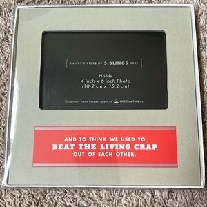 “And to think we used to beat the living crap out of each other” picture frame